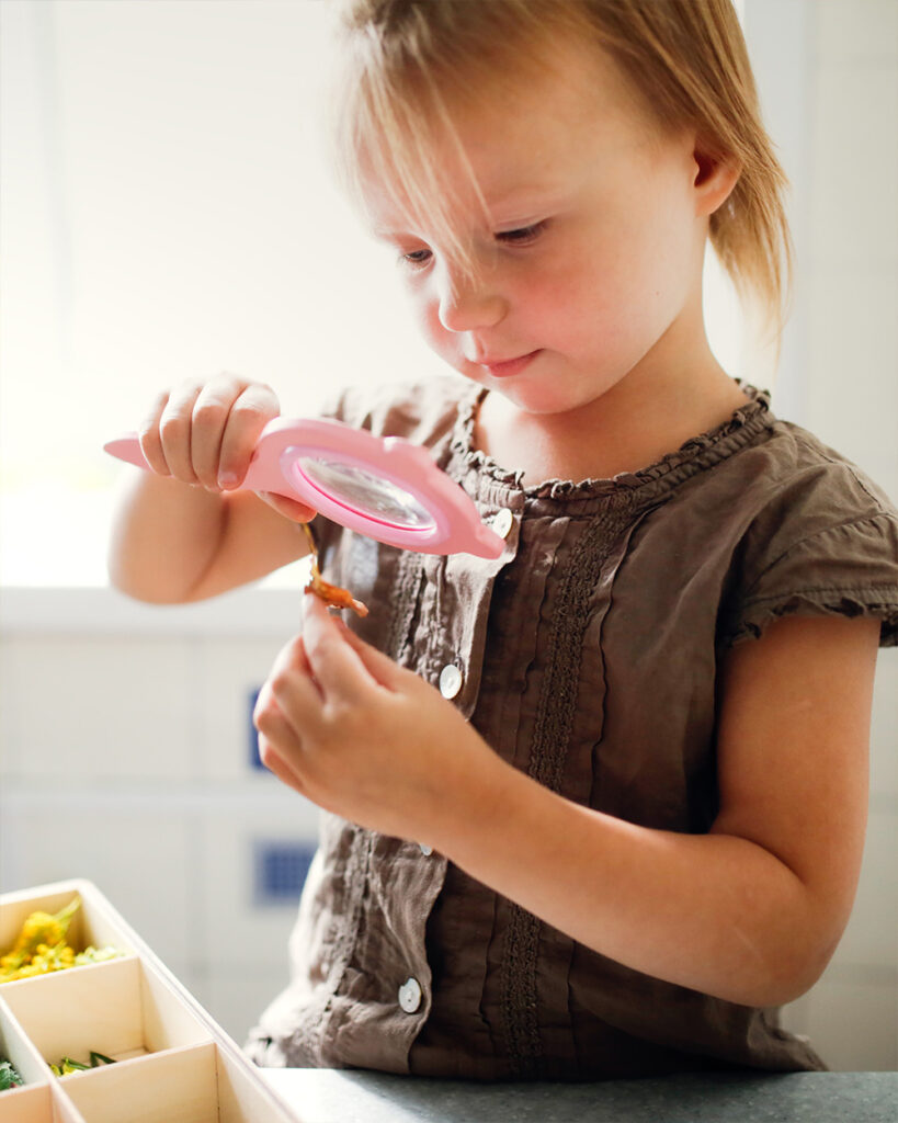 girl with magnifying glass